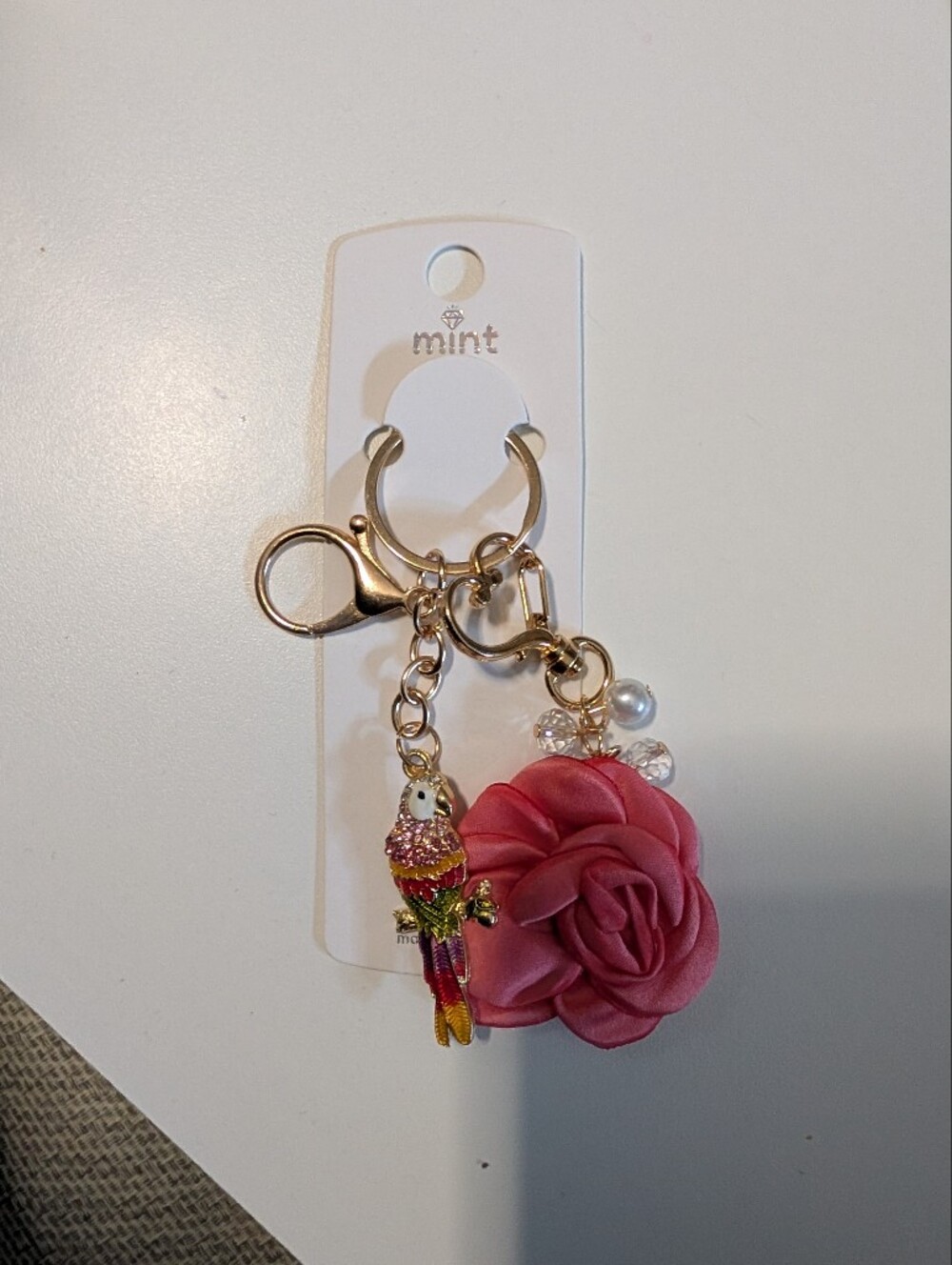 Mint pink rose and parrot keyring with gold hardware